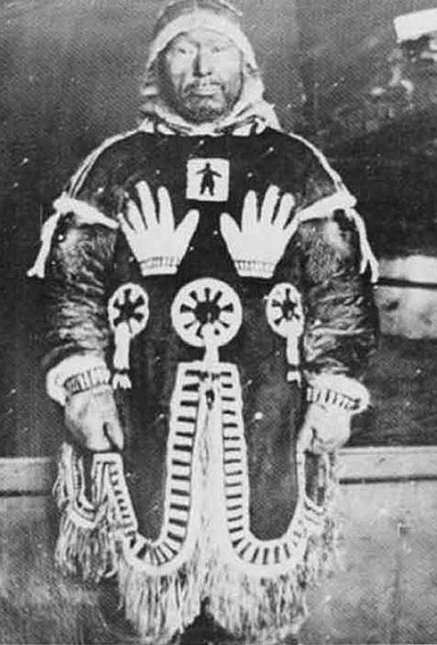 Salome Awa with a photo of her great-grandfather's sacred Inuit design