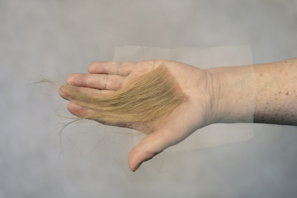 Offering, blonde hair piece photographed by Leslie Osterling