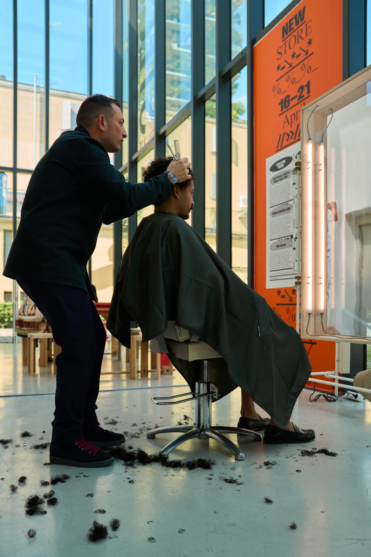 Haircut taking place at the Milan Design Week pop-up salon